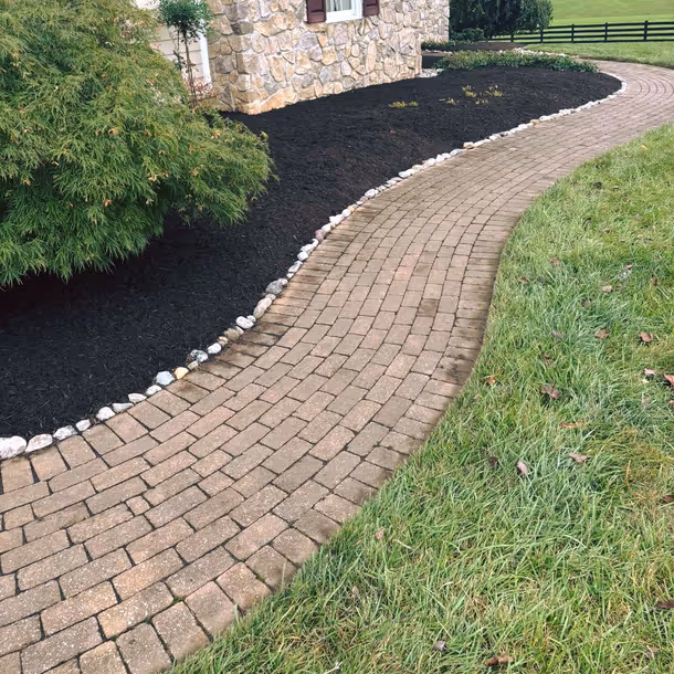 Lawn care and landscaping project by Tim's Outdoor Services