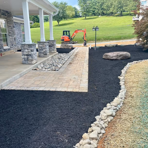 Lawn care and landscaping project by Tim's Outdoor Services