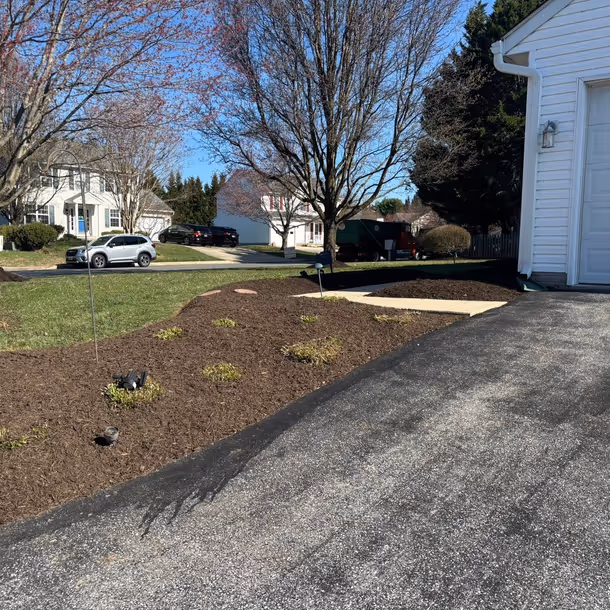 Lawn care and landscaping project by Tim's Outdoor Services
