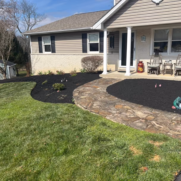Lawn care and landscaping project by Tim's Outdoor Services