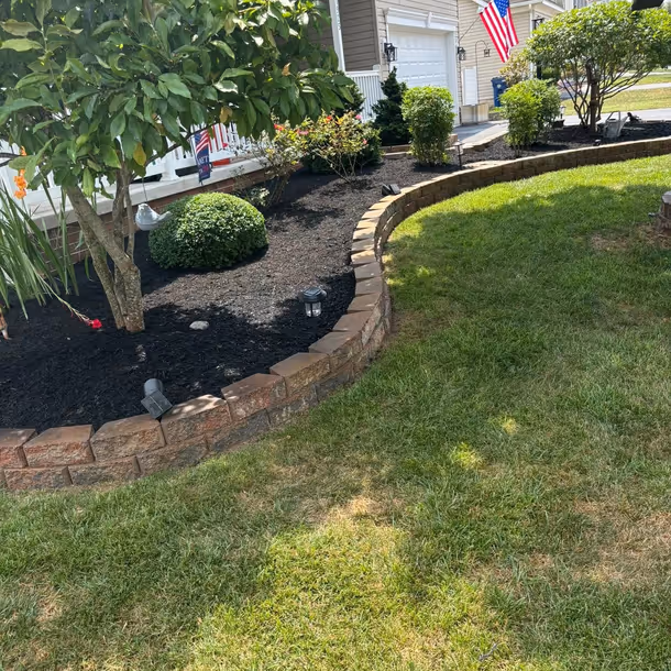 Lawn care and landscaping project by Tim's Outdoor Services