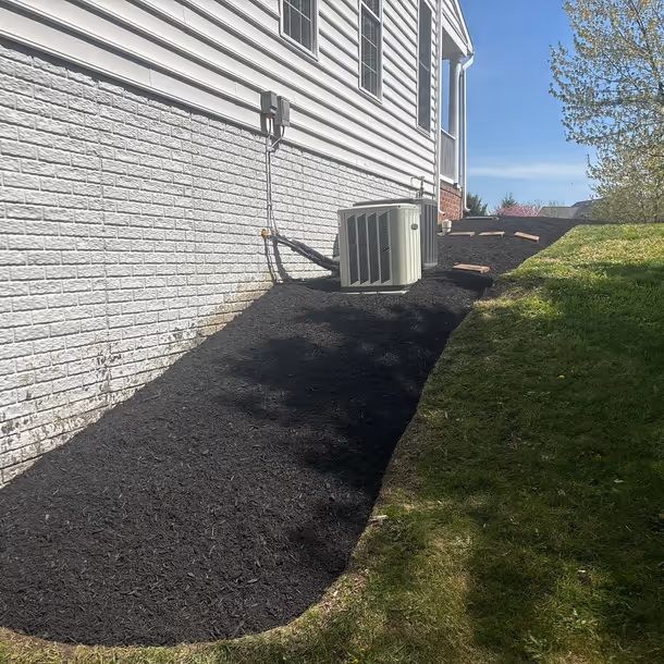 Lawn care and landscaping project by Tim's Outdoor Services