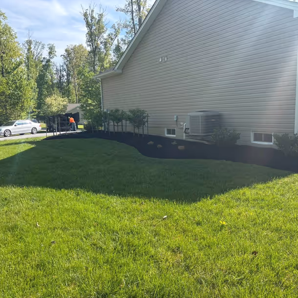Lawn care and landscaping project by Tim's Outdoor Services