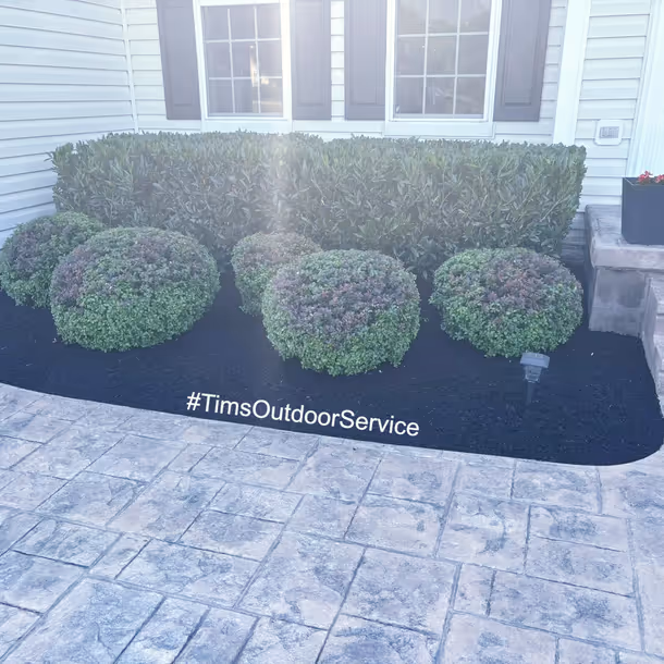Lawn care and landscaping project by Tim's Outdoor Services