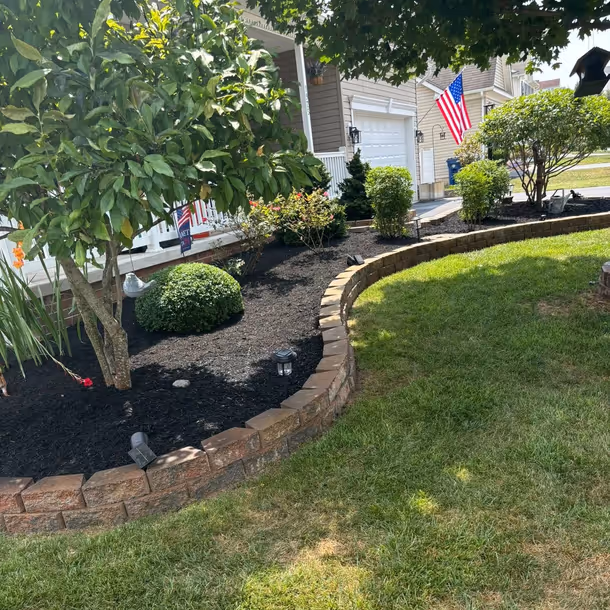 Lawn care and landscaping project by Tim's Outdoor Services