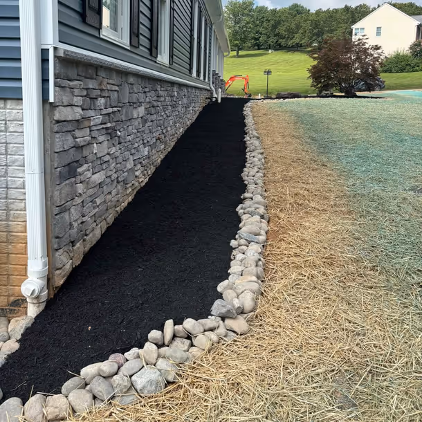 Lawn care and landscaping project by Tim's Outdoor Services